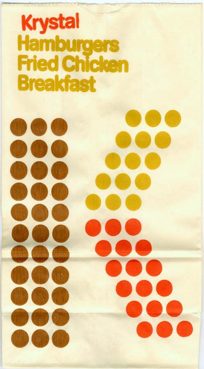 Packaging depicts: The letter K formed by blocks of brown, yellow and orange dots.