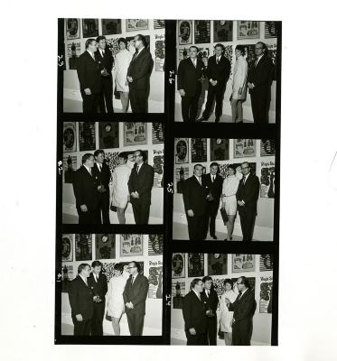 Photographic Materials depicts: A two-by-three grid of six photos of three men and one woman standing in front of artworks