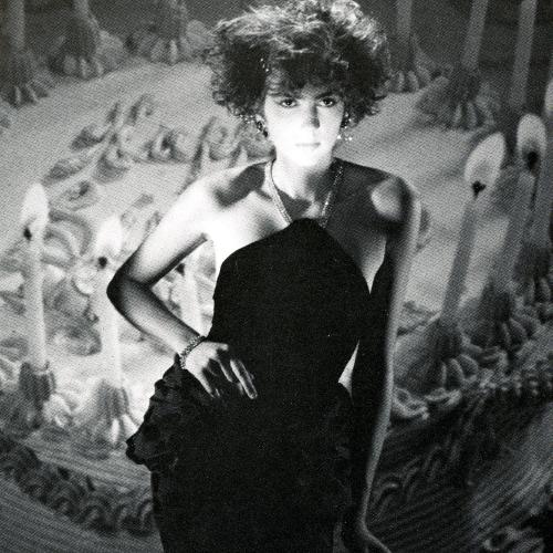Announcements and invitations depicts: black and white photograph of a woman in front of a giant birthday cake with candles
