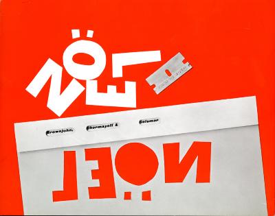 Cards depicts: Envelope with "NOEL" cut out of it and placed above with a razor blade. 
