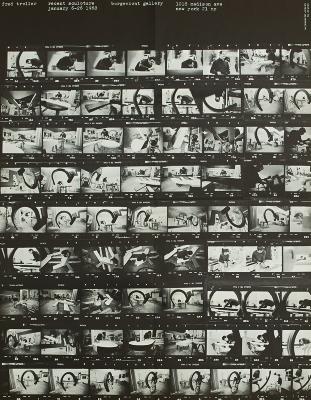 Posters depicts: Sheet of negatives of various photographs of a modern art sculpture