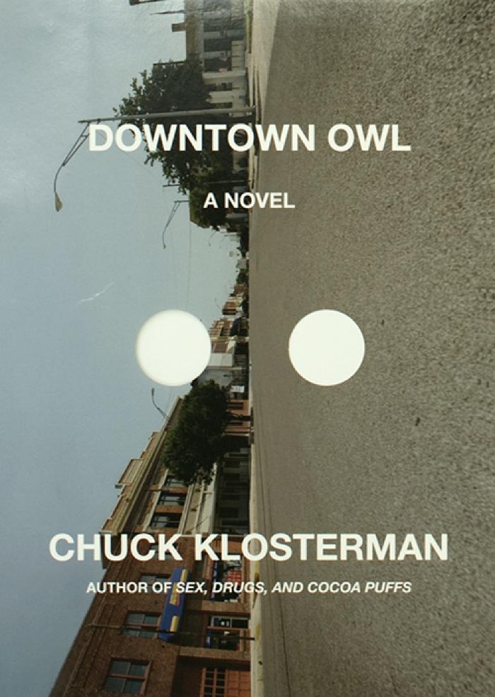 Book Covers depicts: View of a street taken from the road, image is sideways 