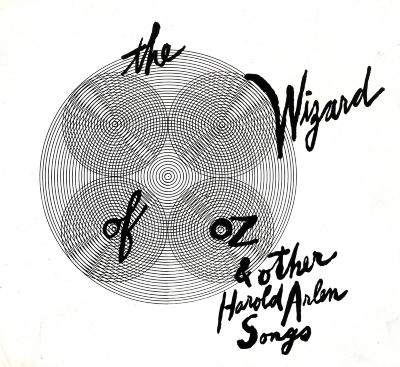 Album Covers depicts: 4 sets of inwardly repeating lines of circles sit inside of a larger inwardly repeating lines of circles