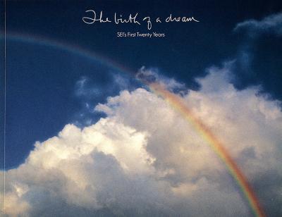 Annual Reports and Corporate Communications depicts: A rainbow passes over a cloudy sky 