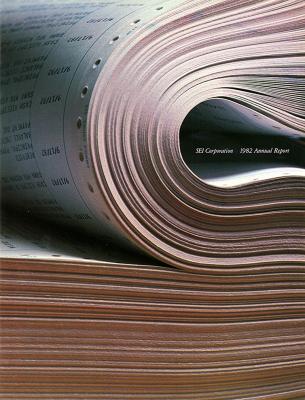 Annual Reports and Corporate Communications depicts: A stack of papers are seen up close, some are folded over 