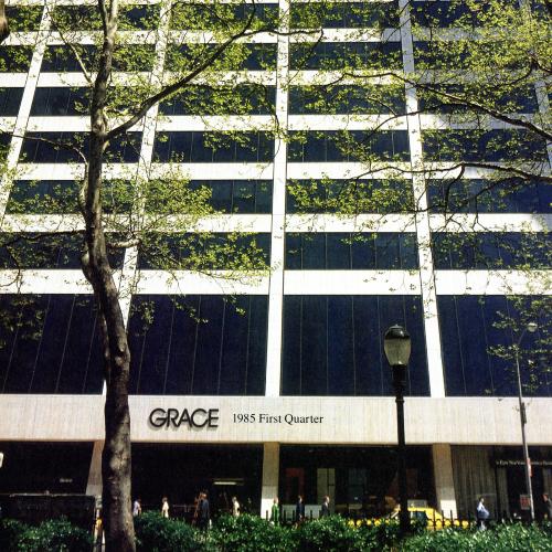 Annual Reports and Corporate Communications depicts: The front of the Grace office building with trees in front of it