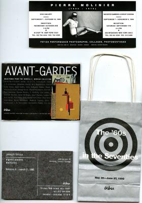 Announcements and invitations depicts: Three gallery invite cards, one with a photograph of a naked man with a mask, and a gray paper bag with a black target on the front 