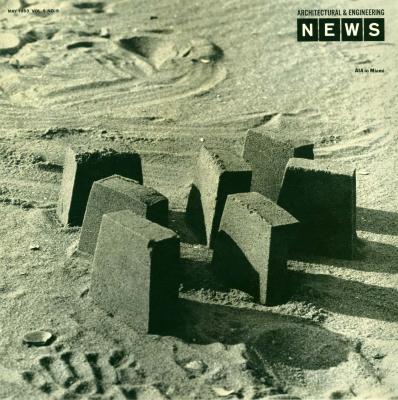 Serial Publications depicts: Seven rectangular structures made out of sand on the beach