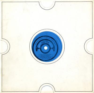 Serial Publications depicts: white record sleeve with die-cut circle for blue flexi disk inside