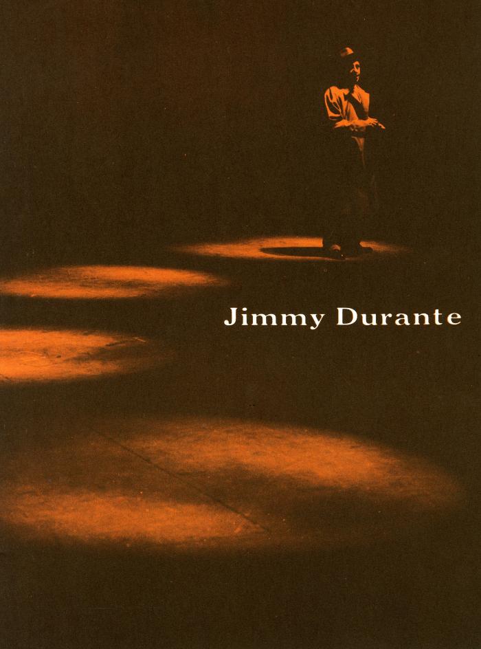 Programs depicts: A man standing in a spotlight next to three other spotlights 