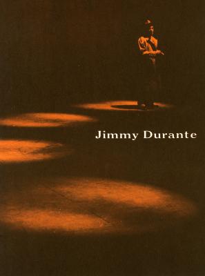 Programs depicts: A man standing in a spotlight next to three other spotlights 