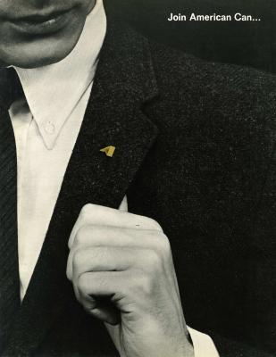 Booklet/Brochure depicts: Close up of a man in a suit holding his lapel with a pin on it 