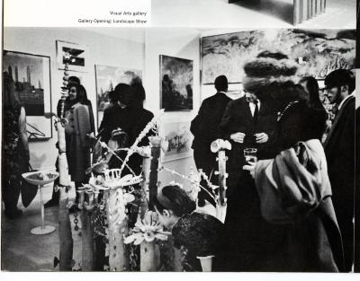 Photographic Materials depicts: People in gallery viewing hung artworks and sculpture