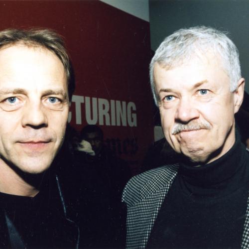 Photographic Materials depicts: two men looking into the camera