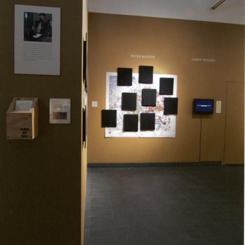 Photographic Materials depicts: photograph of artworks installed in gallery