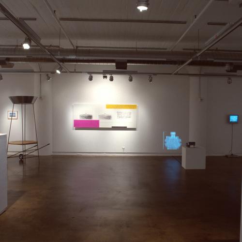 Photographic Materials depicts: photograph of gallery with artworks installed