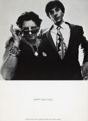 Cards depicts: Man in a suit with his arm around an older woman peering over her sunglasses, they both are looking at the viewer