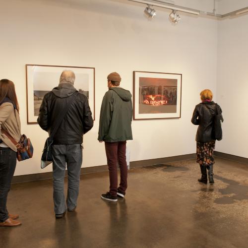 Digital Files, Photographic Materials depicts: people looking at artworks in gallery