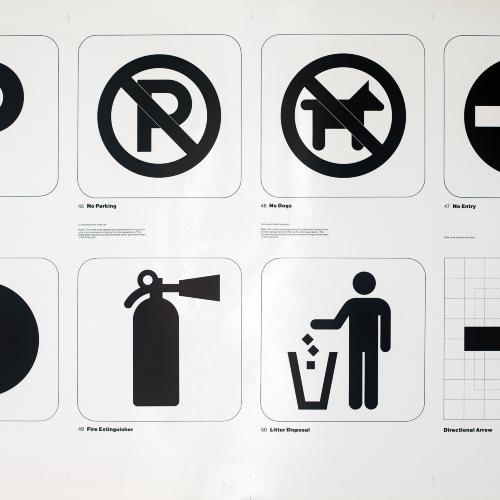 Posters depicts: two by four grid of transportation symbols: parking, no parking, no dogs, no entry, exit, fire extinguisher, litter disposal, directional arrow