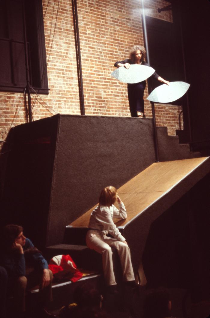 Photographic Materials depicts: woman holding oval shapes on a ramp