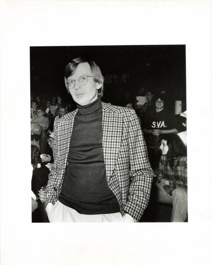 Photographic Materials depicts: black and white photograph of Elder with back to audience
