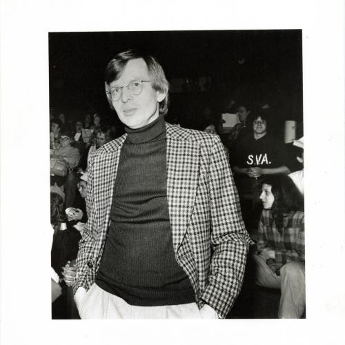 Photographic Materials depicts: black and white photograph of Elder with back to audience