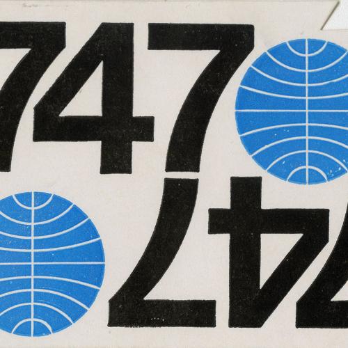 White luggage tag with the numbers "737" written in black and a blue circle with white lines running through it. Its mirror image is on the bottom side of the luggage tag such that when the tag is flipped it reads the same way.