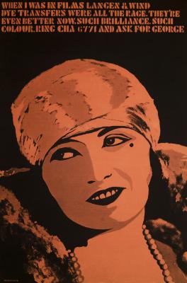 Posters depicts: Glamorous woman with headwrap in two colors, black and golden pink. Type at top of poster is in an art deco style