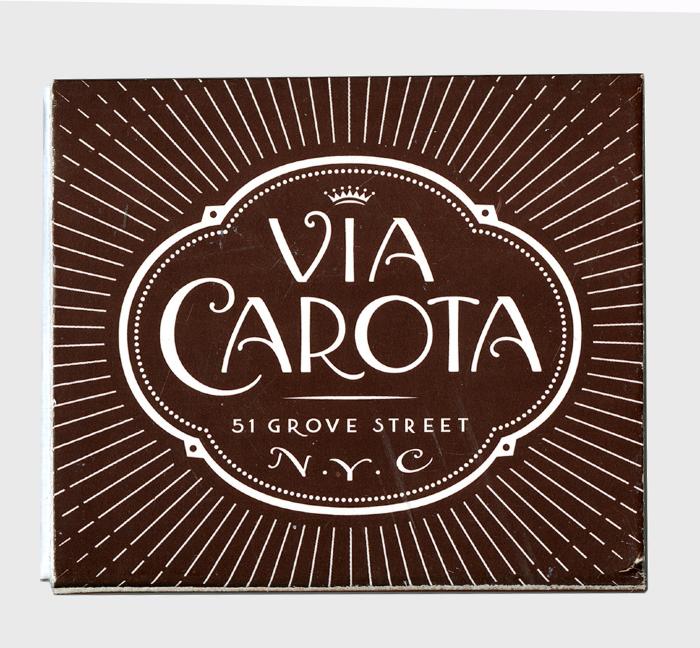 Packaging depicts: Swoopy logotype on a brown background