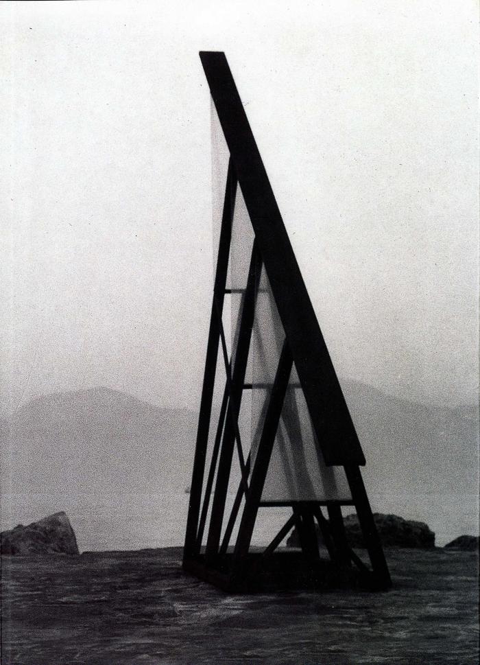 Exhibition Catalogues depicts: large triangular outdoor sculpture in dramatic landscape in black and white photo