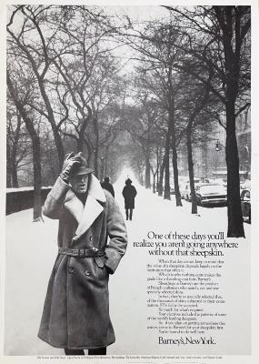 Advertisements depicts: Man walking down a snowy tree lined street wearing a fur lined coat and a hat