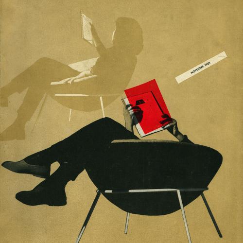 man sitting upside down with legs hanging over the back of a rounded chair
