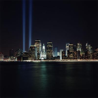 Photographic Materials depicts: Downtown New York skyline at night, with two beams of light where the twin towers once stood