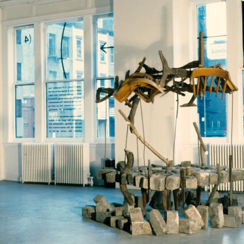 Photographic Materials depicts: color slide of artworks installed in a gallery, on windows