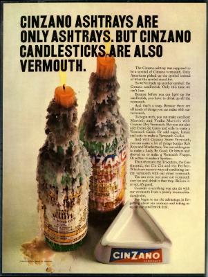Advertisements depicts: Two bottles of Cinzano covered in wax each with a lit candle stuck in the stem next to a triangular Cinzano ashtray 