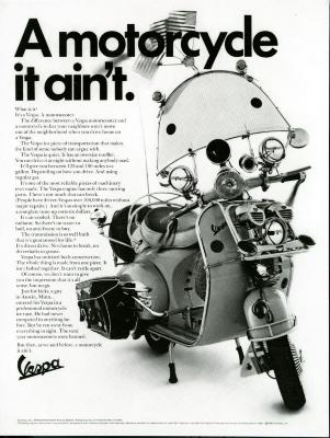 Advertisements depicts: A vespa decked out with bags, a windshield, and flags