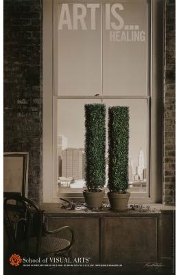 Posters depicts: Primarily sepia photograph of a room's window overlooking a cityscape. Two green potted plants are on the windowsill, trimmed to look like the twin towers.