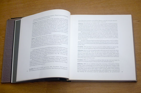 Book opened to show full pages of text