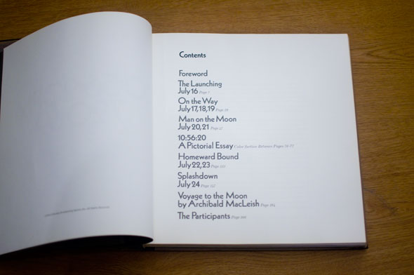 Book opened to show table of contents on white paper