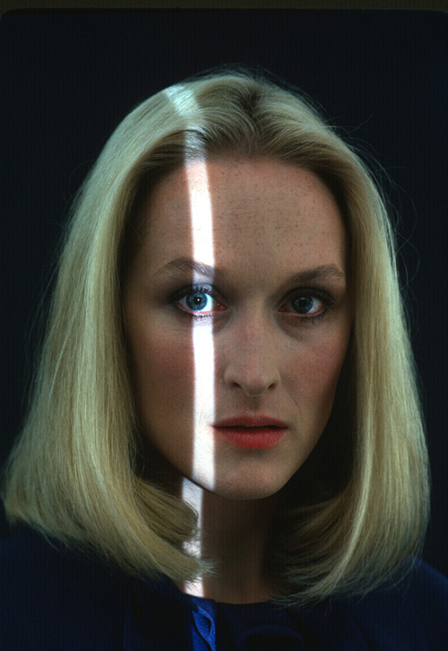 Photo Portrait of Meryl Streep with a strip on light exposing her right eye. 